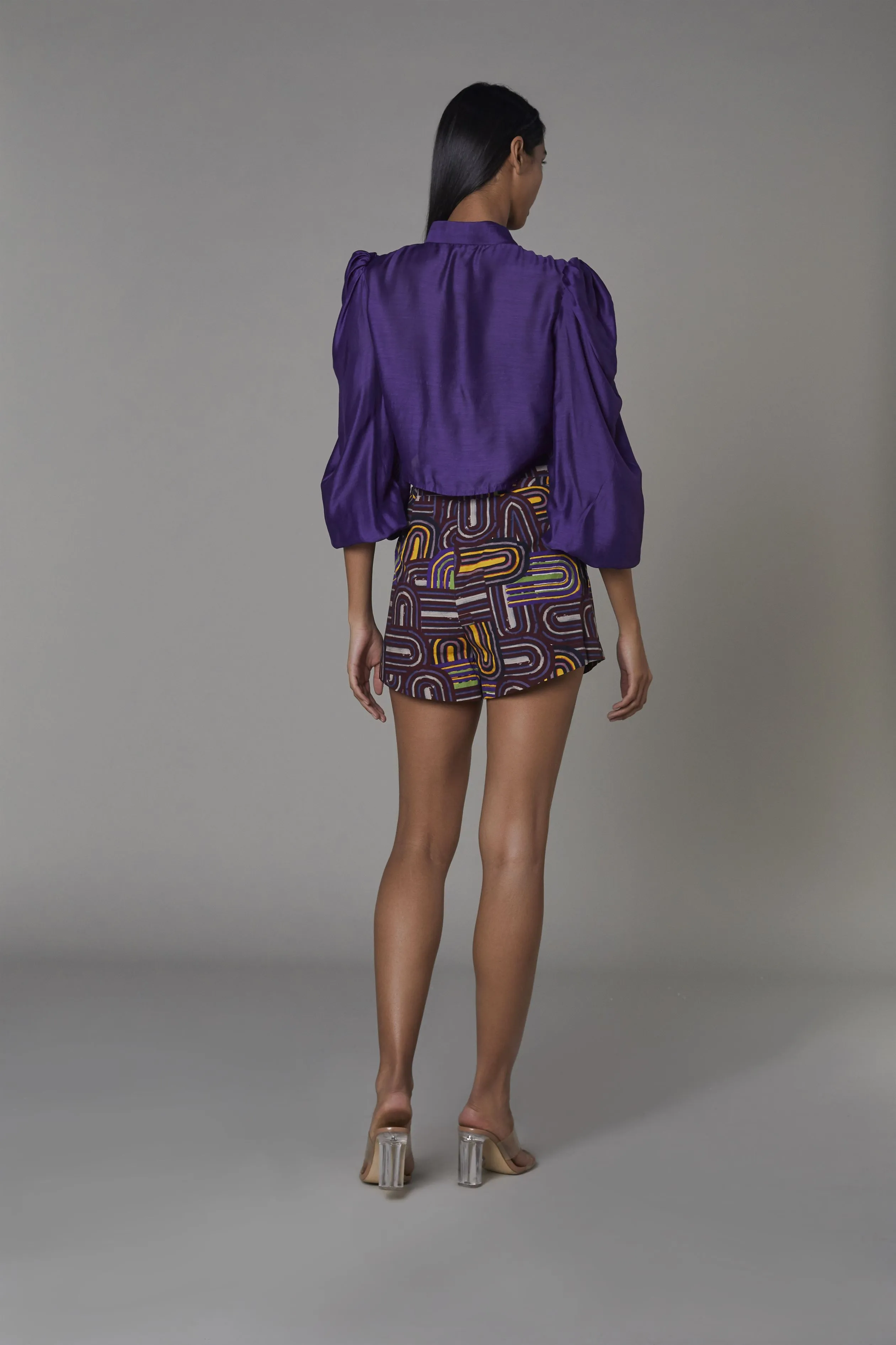 Saaksha & KinniÂ    I   Solid purple non-print knot shirt  Purple semi circle shorts Blouse - Cotton Silk  Shorts - Satin Purple   SS22054    SS22055